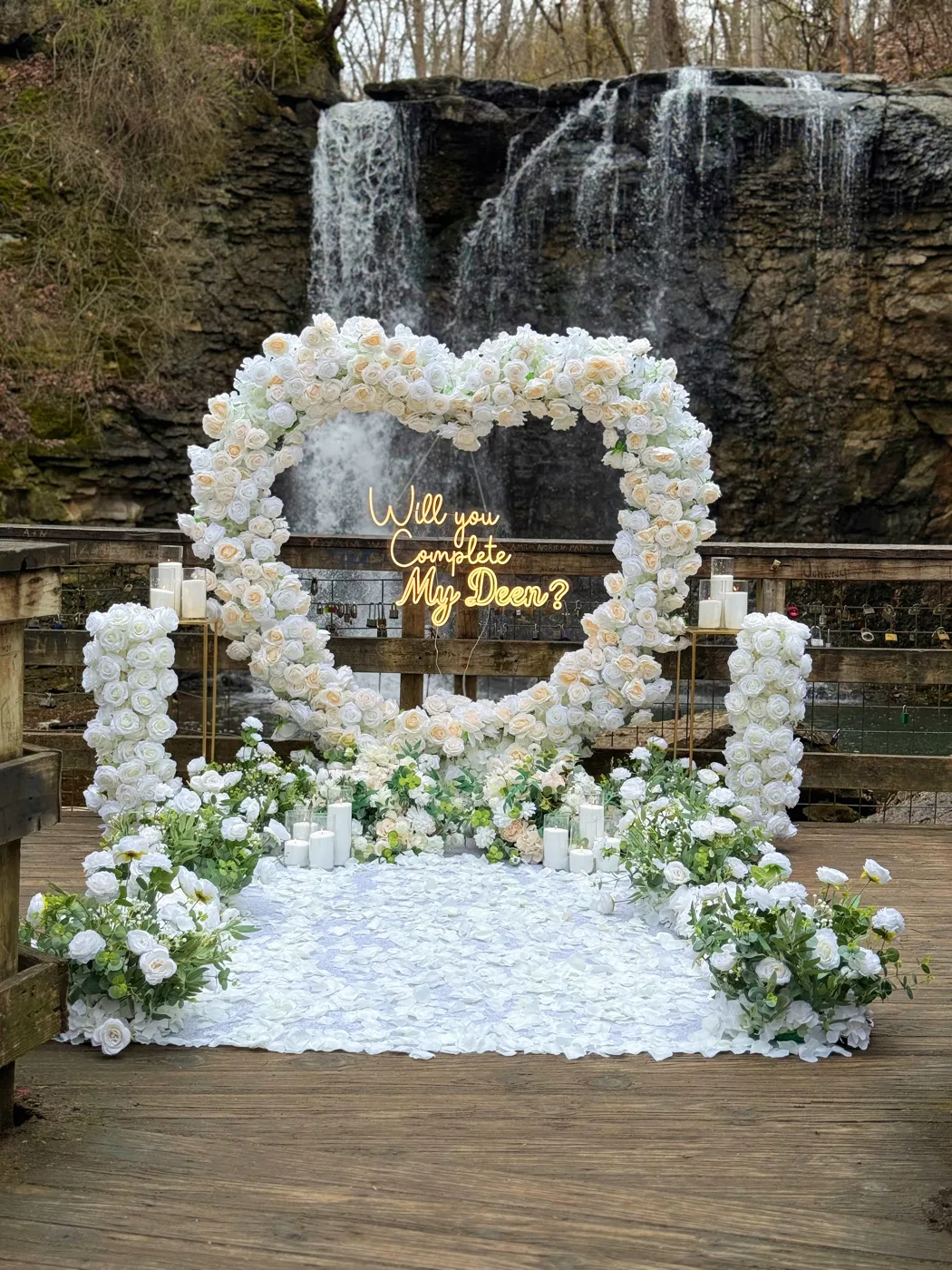White rose heart arch with custom neon sign proposal decor