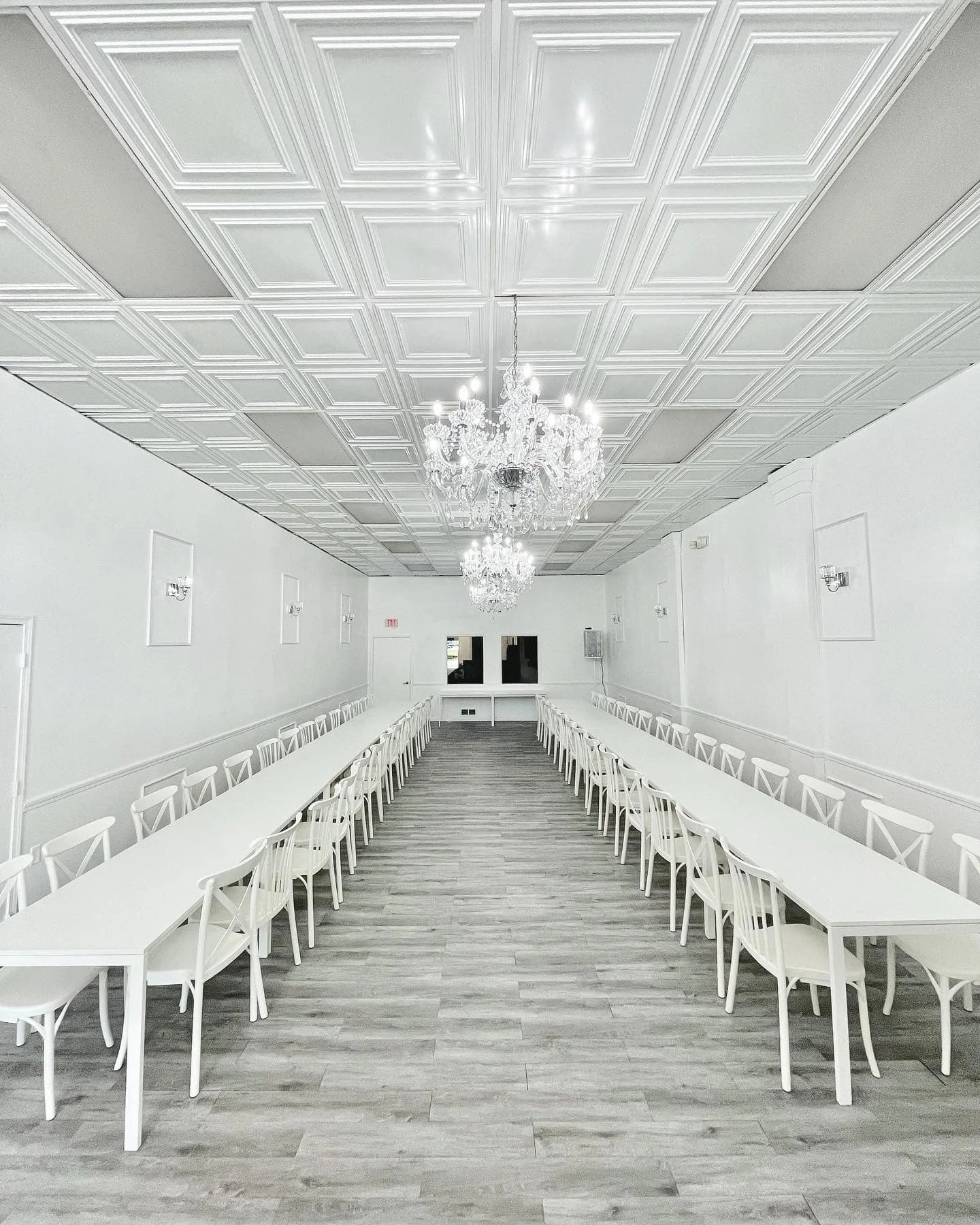 Blanco Event Center all-white venue with crystal chandelier and elegant seating